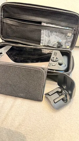 Asus ROG Ally Xbox X (handheld) with case and Asus ROG wireless earbuds