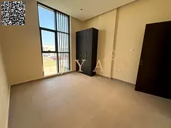 Annual rent: 2BR in Al Jurf 3, built-in wardrobes, central AC, balcony, 2 baths, 1 month free, flexi