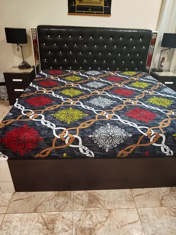 Queen bed frame with upholstered headboard and matching bedside tables and the mattress is 1000 dhs