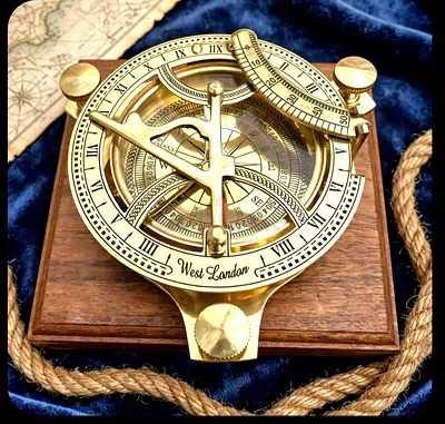 Beautiful  vintage  brass compass with sun timer in wooden  box from london  for sale.