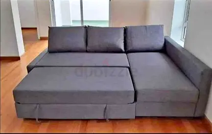 Grey L-shaped pull-out sofa bed, good condition
