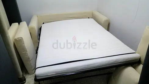 Cream fabric sofa bed with mattress - pulls out into double bed
