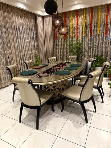 Elegant 8-Seater Oval Dining Table with Upholstered Chairs