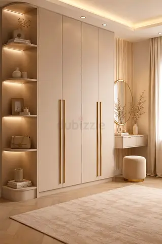 Modern built-in wardrobe with shelving and gold handles