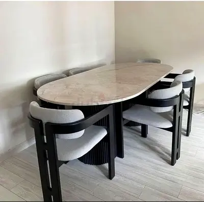 Modern oval marble-top dining table with 6 upholstered chairs