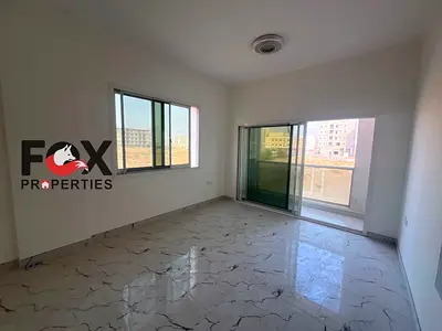 1BR for annual rent in Al Alia, Ajman. Brand-new building, 2 baths & balcony. AED 33,000/year, 6 payments. Cheque deposit.