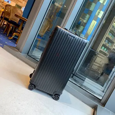 RIMOWA ESSENTIAL or similar premium multiwheel luggage