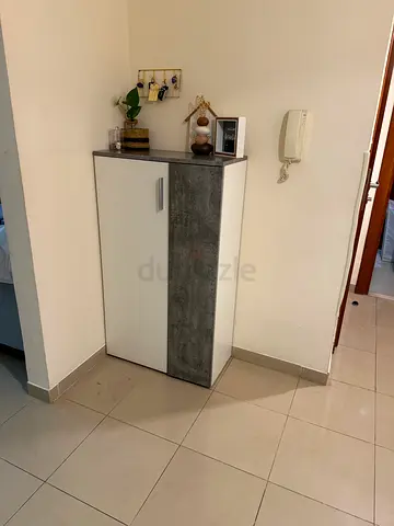 Compact two-door storage shoe cabinet with concrete-look finish