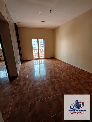 2BR in Al Ghuwaier next to MNC Royal, balcony, central AC & gas, spacious kitchen. AED 35K.