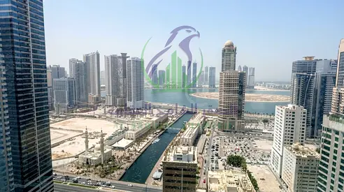 2BR apartment for rent in Al Majaz 3 with sea views from all rooms, 2 master bedrooms, balcony, storage, gym, pool, 1 month free, 6 payments.