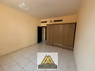 2BR apartment in Al Nuaimiya 2, Ajman: balcony, wardrobes, central AC, 2 bathrooms, free maintenance. AED 34K/year, 4 payments.