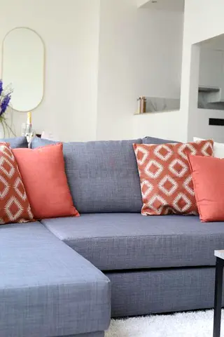 Grey Fabric L-Shaped Sofa with Throw Pillows