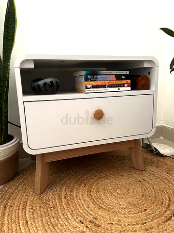 White bedside table with drawer and wooden legs - good condition