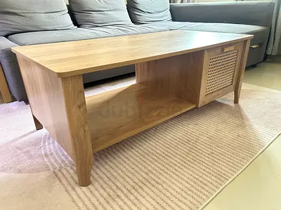 Light oak coffee table with storage cabinet — good condition