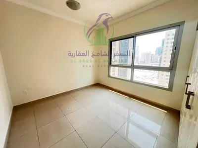 2BR apartment for annual rent in Al Taawun, Sharjah, featuring a master bedroom, 2 bathrooms, balcony, built-in wardrobes, free parking, and free gym