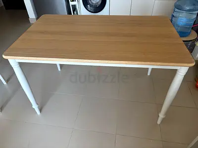 Light wood dining table with white turned legs - good condition. Also 3 chairs along with it