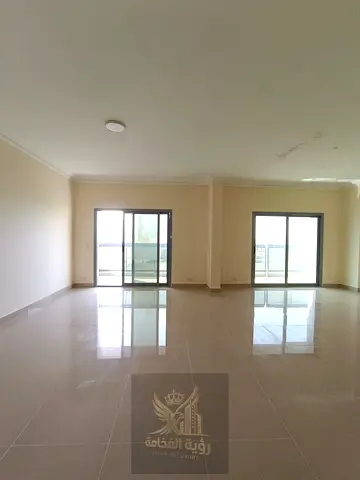Two-Bedroom Apartment with Balcony and Direct View of Al Majaz Park & Lake