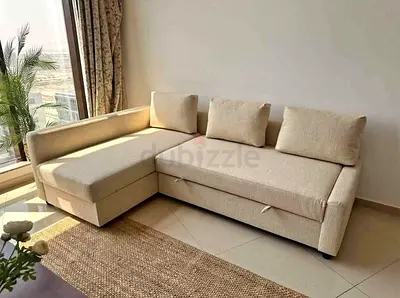 Beige L-shaped Sofa Bed with Storage - Good Condition