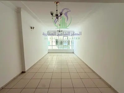 Two bedroom apartment for annual rent in Al Taawun Sharjah balcony open view built in wardrobes large hall free gym swimming pool three bathrooms