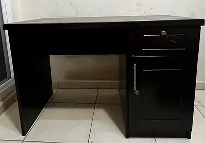 Solid dark wood office desk with lockable drawer and cabinet