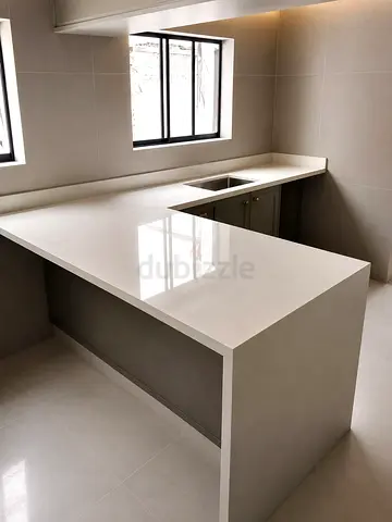 Custom Made Kitchen Counter with Marble Top and Matching Backsplash