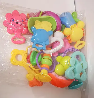 Bundle of assorted baby rattles and teethers - mixed colors, good condition