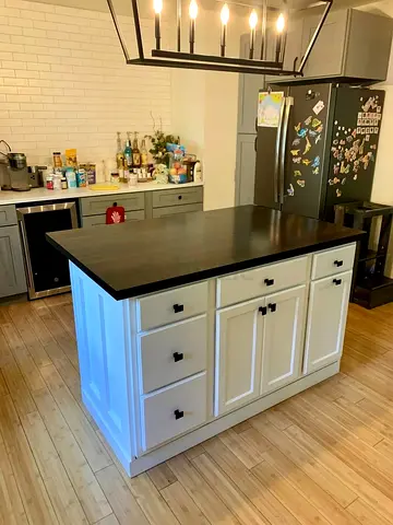 Modern Kitchen Island with Dark Wood Top and White Cabinets