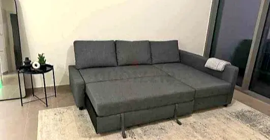 Grey L-shaped Sofa Bed with Storage — Good Condition