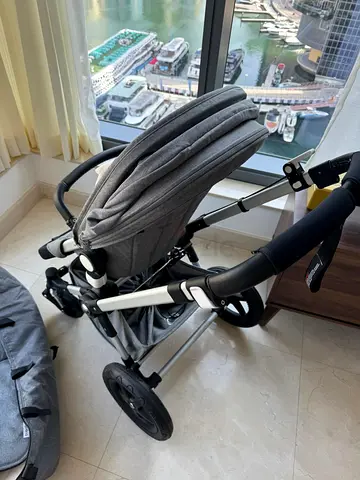 Light grey pram stroller in good condition - reversible seat, adjustable hood
