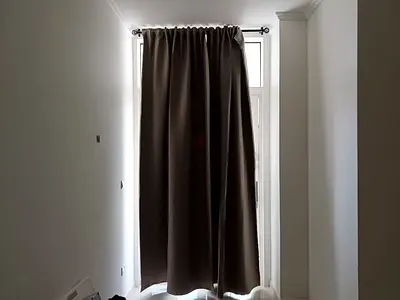 Brown IKEA darkening panels and rod