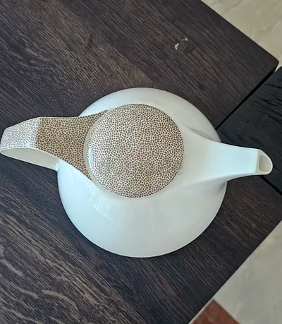 White Ceramic Teapot with Textured Handle and Lid