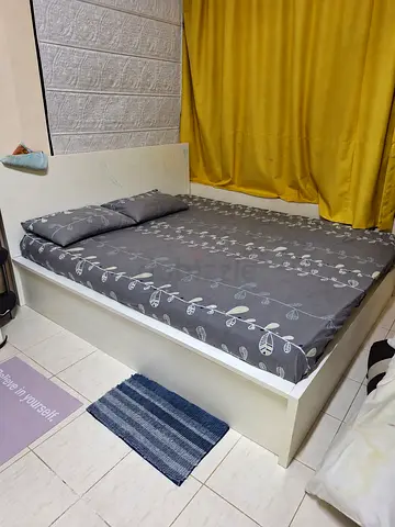 White ikea king size bed frame with headboard and mattress