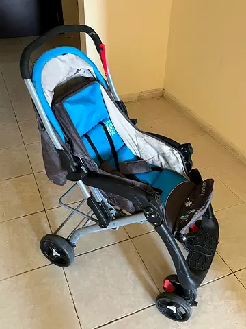 Blue-grey baby stroller in good used condition