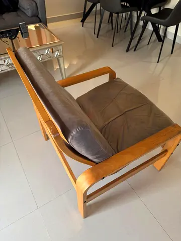 Wooden frame lounge armchair with brown cushions — good used condition
