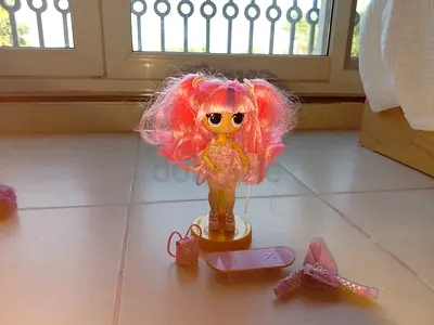 Small pink lol collectible fashion doll with accessories (skateboard, bag, shoes)