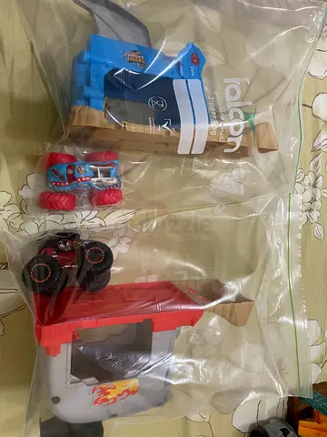 Hotwheels monster trucks launcher and vehicle - used