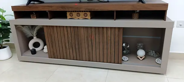 Modern low-profile TV cabinet with sliding wooden doors