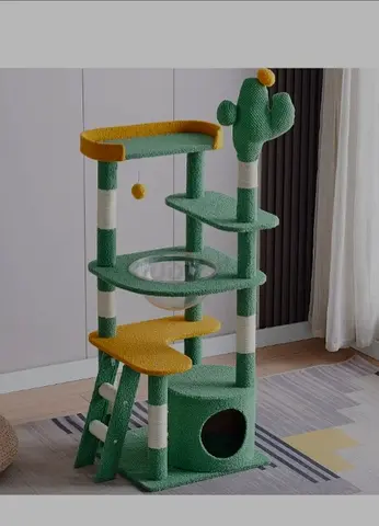 Green cactus-themed multi-level cat tree with scratch posts and hideaway