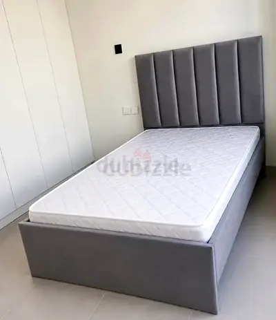 Grey double bed with mattress and storage 120x190
