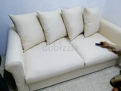 2-Seater Cream Fabric Sofa bed with Cushions - Good Condition