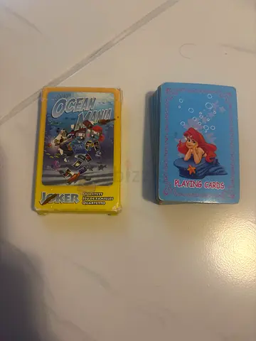 Two packs of kids playing cards — Disney Ariel and Ocean/Robot deck