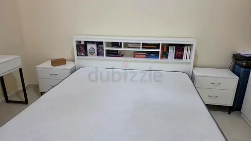 White Bed Frame with Storage Headboard and Matching Nightstands