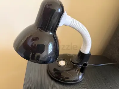 Small black adjustable desk lamp with flexible neck
