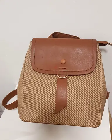 Beige canvas and brown faux leather small backpack — good condition