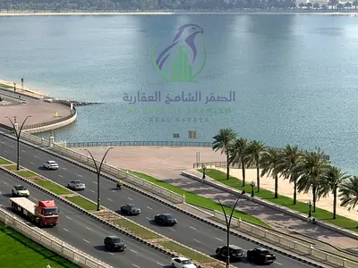 # Luxury 3BR apartment for annual rent in Al Khan Sharjah. Direct sea view spacious layout maid’s room free AC free parking gym pool premium finish