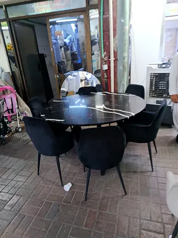 Round black marble dining table with 6 velvet chairs - good condition