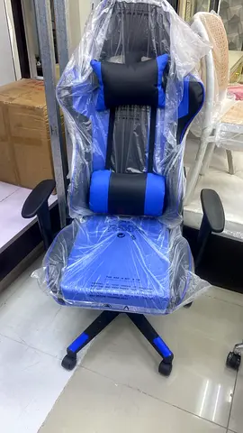 Blue ergonomic gaming/office chair with lumbar and headrest pillows