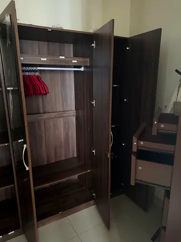 Dark wood 3-door wardrobe with drawers and hanging rail - good condition