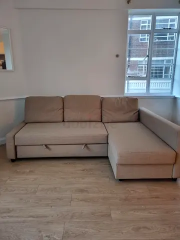 Beige L-shaped Sofa with Chaise and Storage - Good Condition