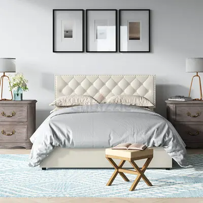 Queen upholstered bed with tufted headboard in cream
